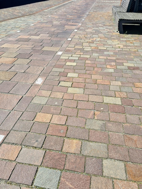 A brick sidewalk with a sign that says'the word'on it