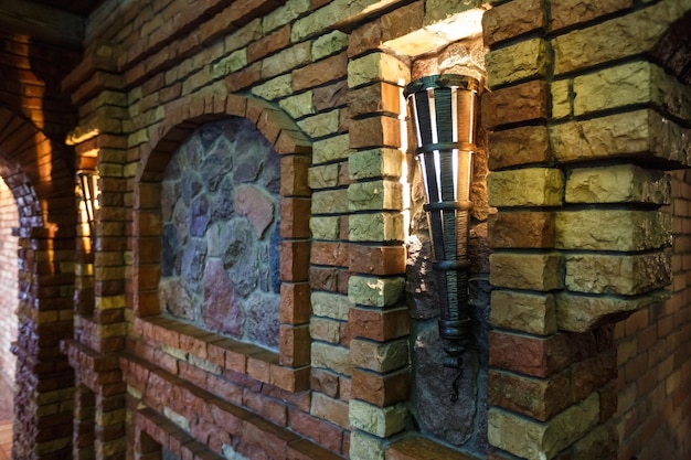 Brick wall in interior guest hall of vacation house in ancient castle style