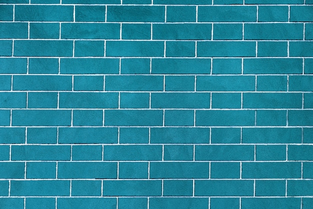 Brick wall is bright blue colored, texture of stone blocks, background of bricks