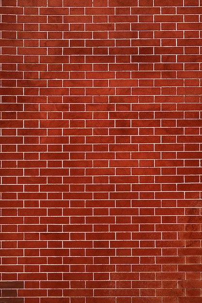 Brick wall is bright red texture of stone blocks background of bricks