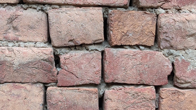 A brick wall with a crack in it