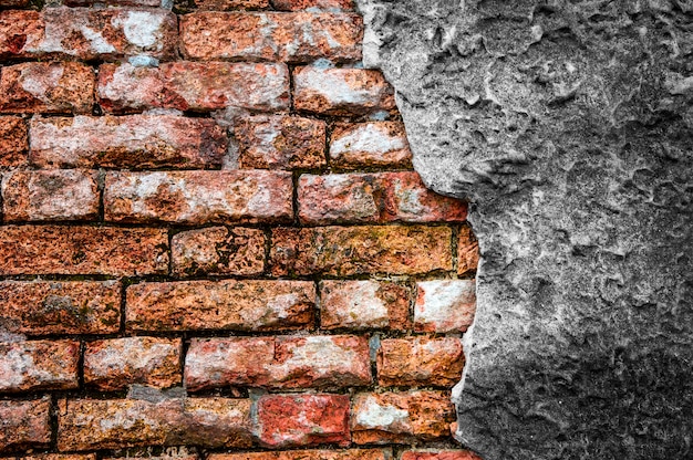 Brick wall with cracked concrete