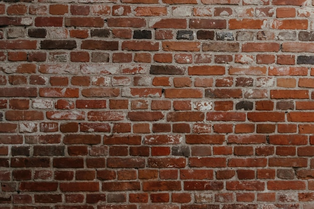 A brick wall with a few missing bricks