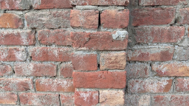 A brick wall with a hole in it