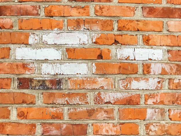 A brick wall with a white line painted on it