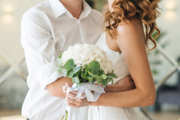 Bridal morning details. Wedding beautiful bouquet in the hands of the bride