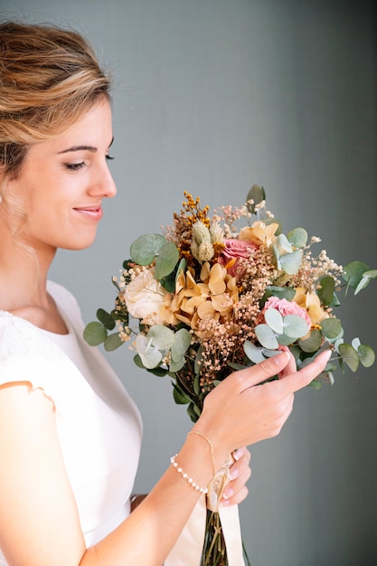 Bride to be married with bouquet of flowers