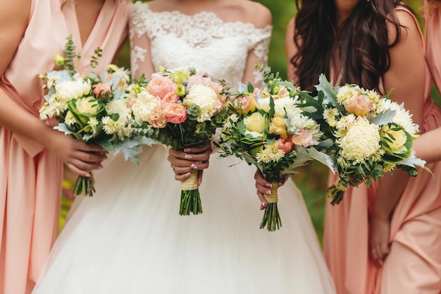 A bride and bridesmaids holding their bouquets