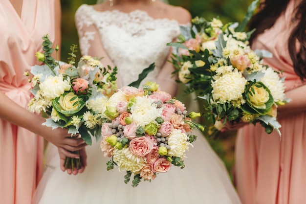 A bride and bridesmaids holding their bouquets