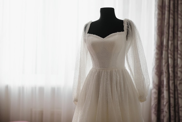 Bride dressing wedding gown. morning bride