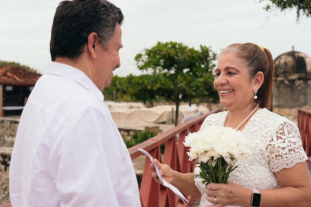 Bride excitedly watching and listening to her groom39s wedding vows