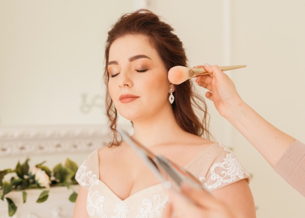 Bride getting  her make up ready