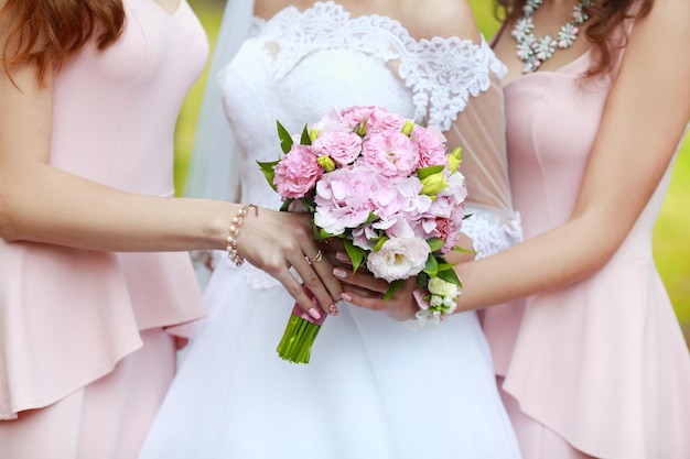 Bride and girlfriends hug in the room Morning Bride and girlfriends