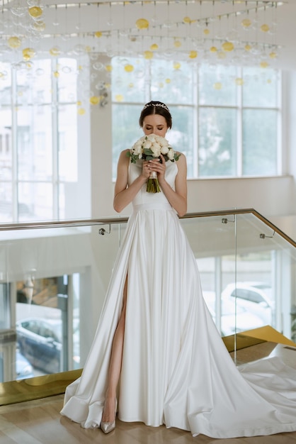 bride on the gold hotel stairs