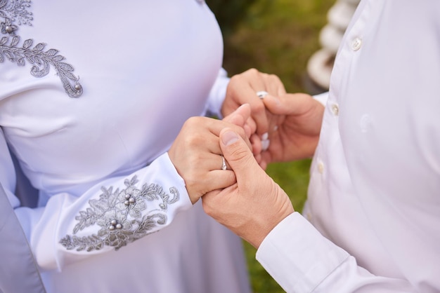 Bride and groom Asian Muslims marry in a beautiful red love theme celebration nikah day