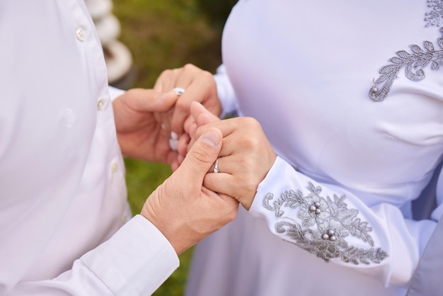 Bride and groom Asian Muslims marry in a beautiful red love theme celebration nikah day