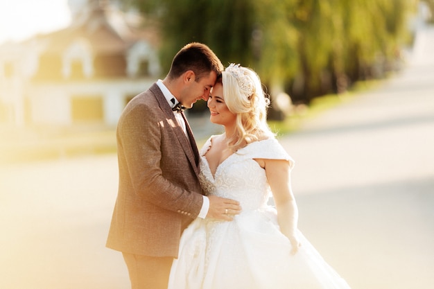 Bride and groom in forest on their wedding, photo session.