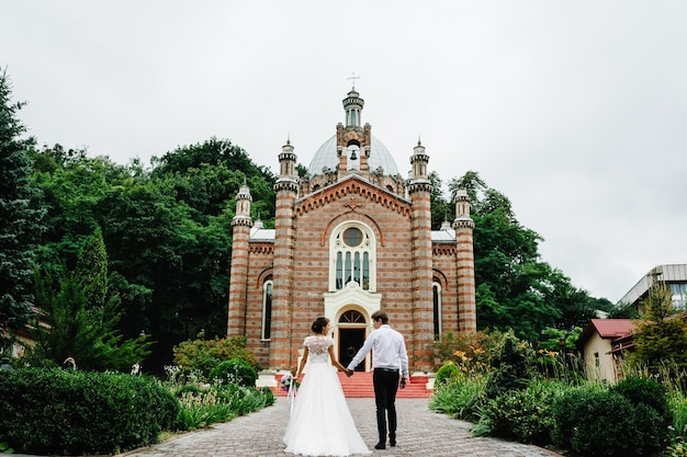 Bride and groom go back to church for a wedding ceremony Concept for marriage made by God to unite only man and woman in a single body