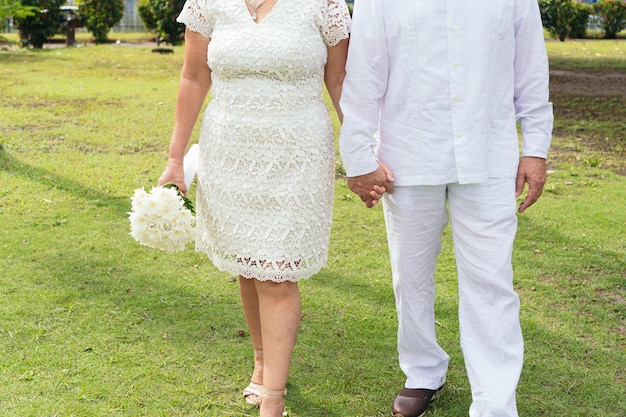 Bride and groom holding hands at the wedding ceremony