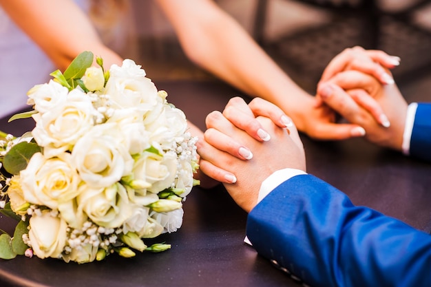 The bride and groom holding hands