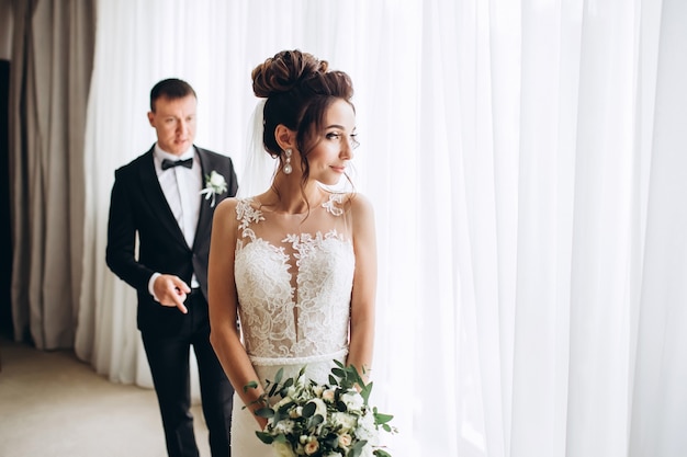 Bride and groom hugging on wedding day