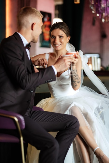 Bride and groom inside a cocktail bar