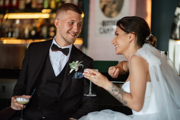 Bride and groom inside a cocktail bar