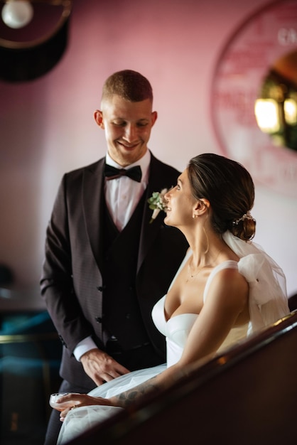 Bride and groom inside a cocktail bar