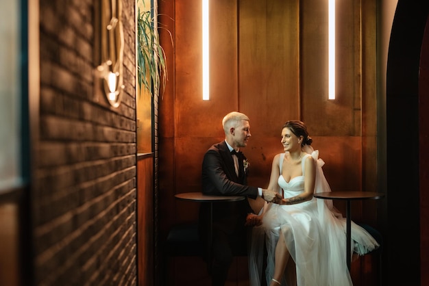 Bride and groom inside a cocktail bar