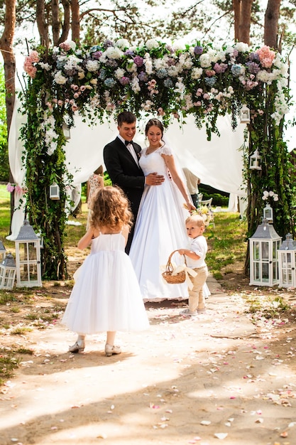 Bride and groom kissing during wedding ceremony