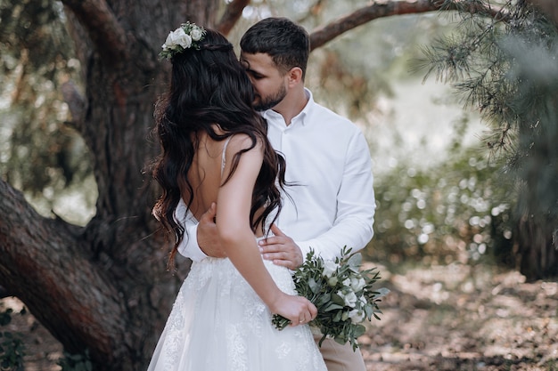 Bride and groom. Luxurious young couple of newlyweds in love posing for the first family wedding photo shoot