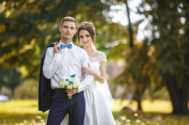 The bride and groom in nature Walk the newlyweds Wedding day The best day of a young couple