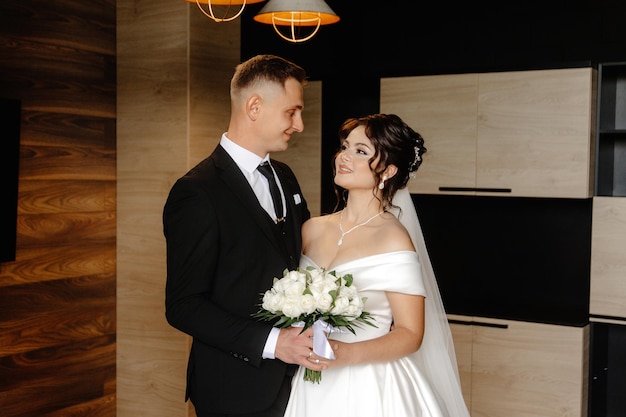 a bride and groom pose for a photo