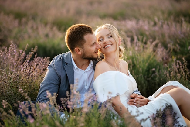 Bride and groom on a walk in the lavender field