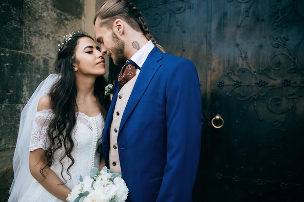 Bride and groom at wedding Day embracing with love Happy romantic young couple celebrating their marriage in churchx9xA