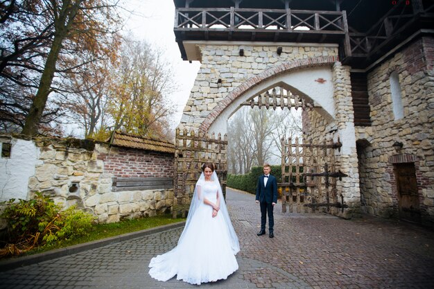 Bride and groom at wedding day outdoors.