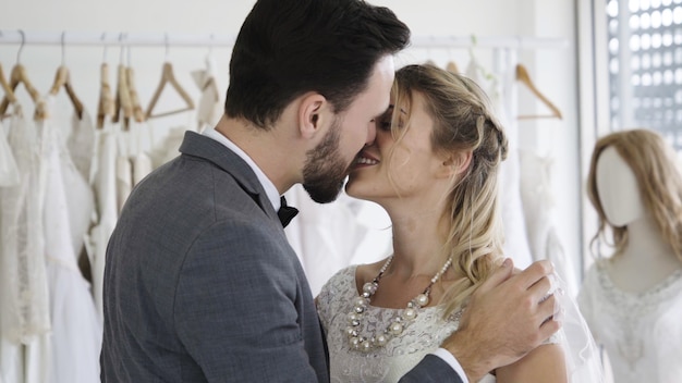 Bride and groom in wedding dress prepare ceremony.