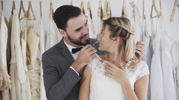 Bride and groom in wedding dress prepare ceremony.