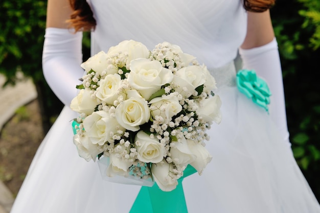 Bride holding beautiful wedding bouquet