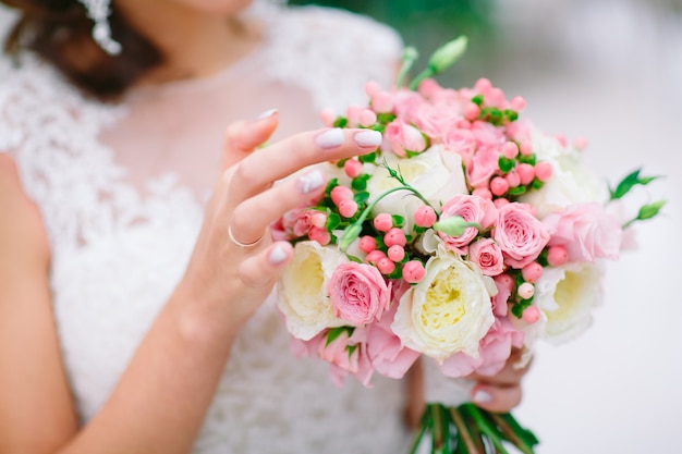 Bride holding bouquet.