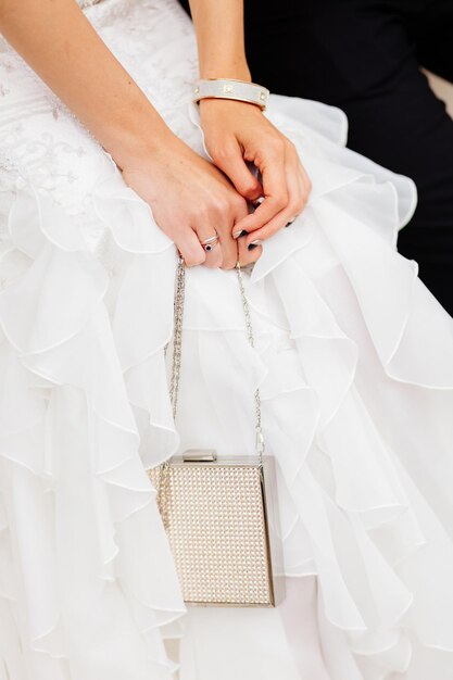 Bride holding clutch bag Fashion clutch background