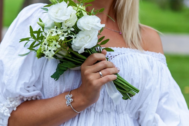 Bride holding a wedding bouquet in her hands