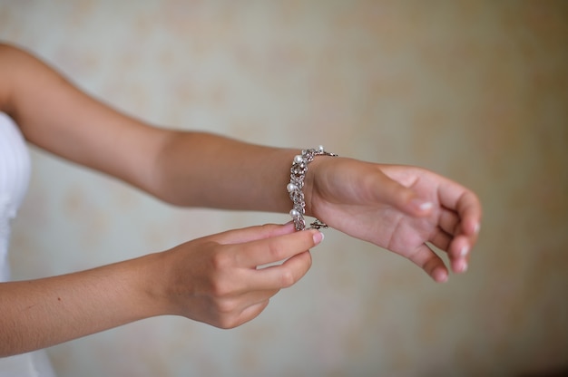 Bride puts on bracelet