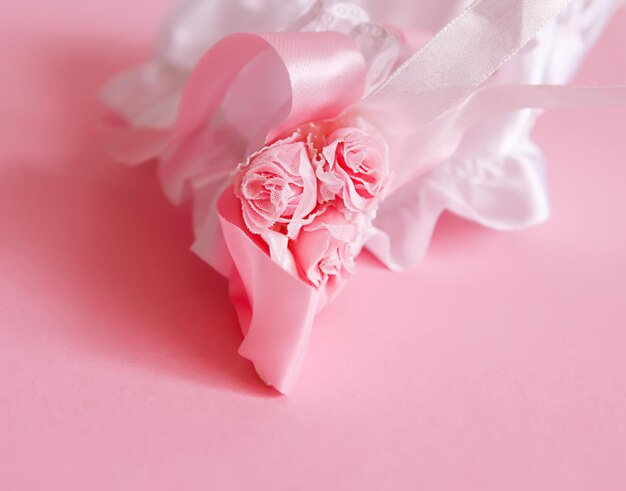 The bride's garter on a pink background