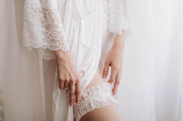 Bride's Woman bride in white silk robe and underwear