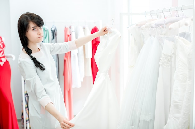 Bride selects the wedding dress