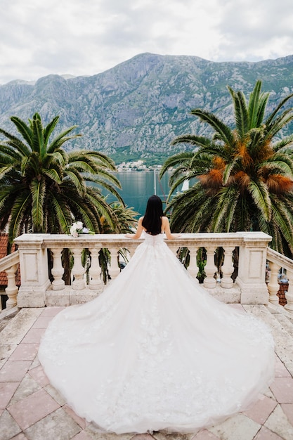 Bride in wedding dress in beautiful location Back view Destination wedding