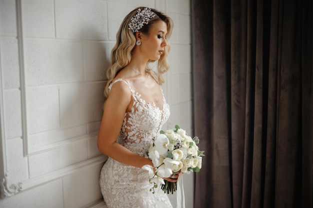 Bride in a white dress with a bouquet of flowers