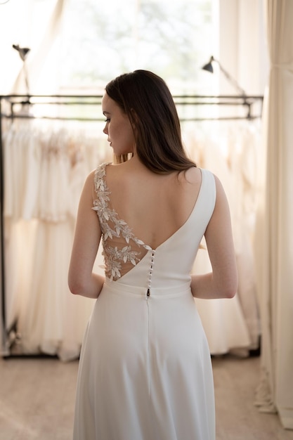 Bride in white wedding dress Back view