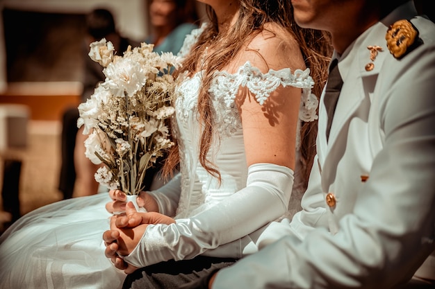 Bride with a bouquet of flowers and wedding dress nature and wedding